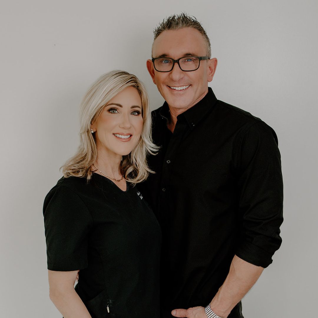 Woman receiving facial treatment at MedJuv clinic.